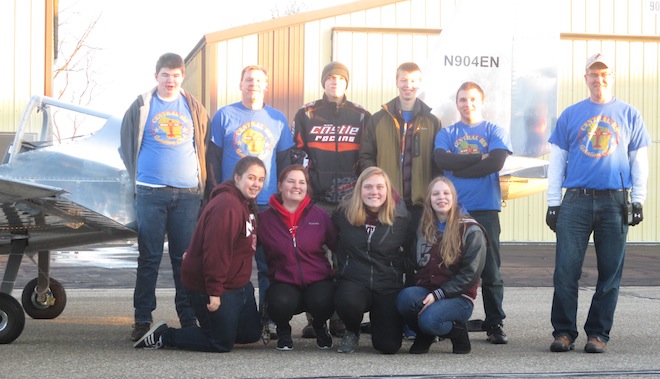 Members of Westosha Central's STEM Aviation Club come together with Falcon 1, an airplane they completed after 13 months of work. Among the 15 students who worked on the plane are (front row, from left) seniors Olivia Rasmussen, Angel Heathcoe, Nicole Jackson and sophomore Rachel Senft; (back row) sophomore Alex McGonegal, program mentor James Senft, senior Jake Lampada, sophomore Josh Engeberg, home-schooled student Declan Steinke and volunteer Ron Chisholm.