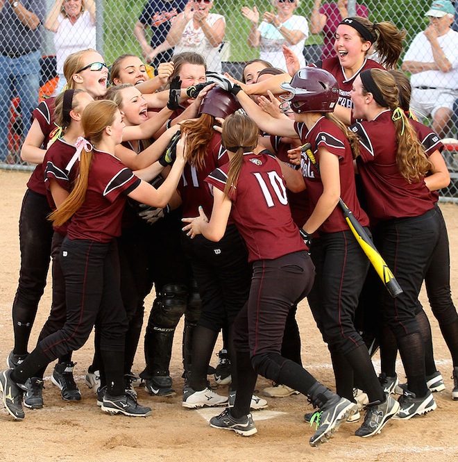 Members of the Westosha Central softball team celebrate a home run on their way to the WIAA Division 1 state softball title last June. The performance ranks sixth among the area's top stories in 2015. (Photo by Earlene Frederick).